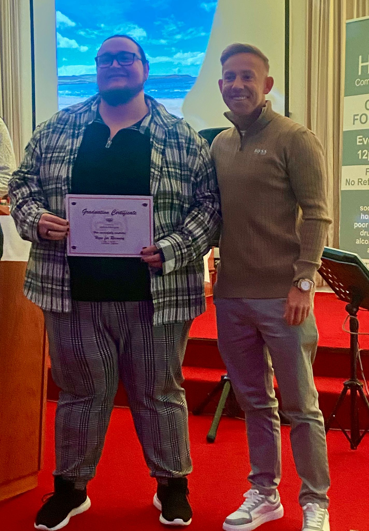 Nicky Low presenting certificates